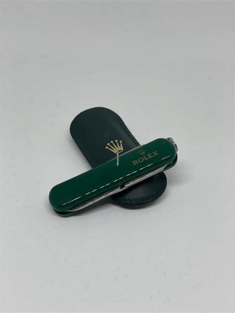 rolex vintage green pocket knife.